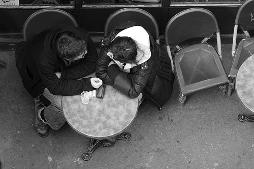 two people talking at a cafe