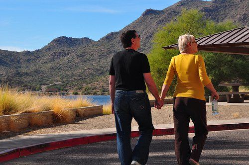 couple holding hands in the mountains