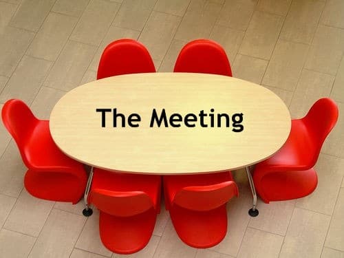 meeting table with red chairs