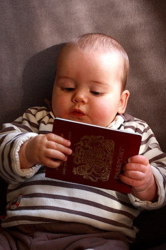 baby holding passport