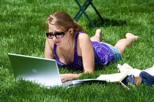 girl using laptop in park