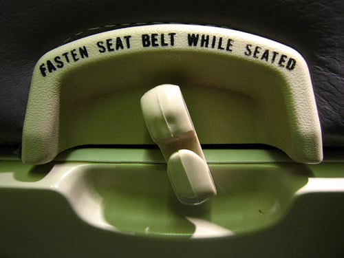 fasten seat belt while seated