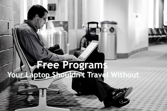 man working on laptop at airport