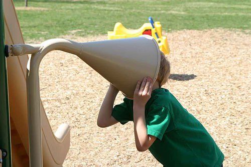 boy with head stuck in funnel